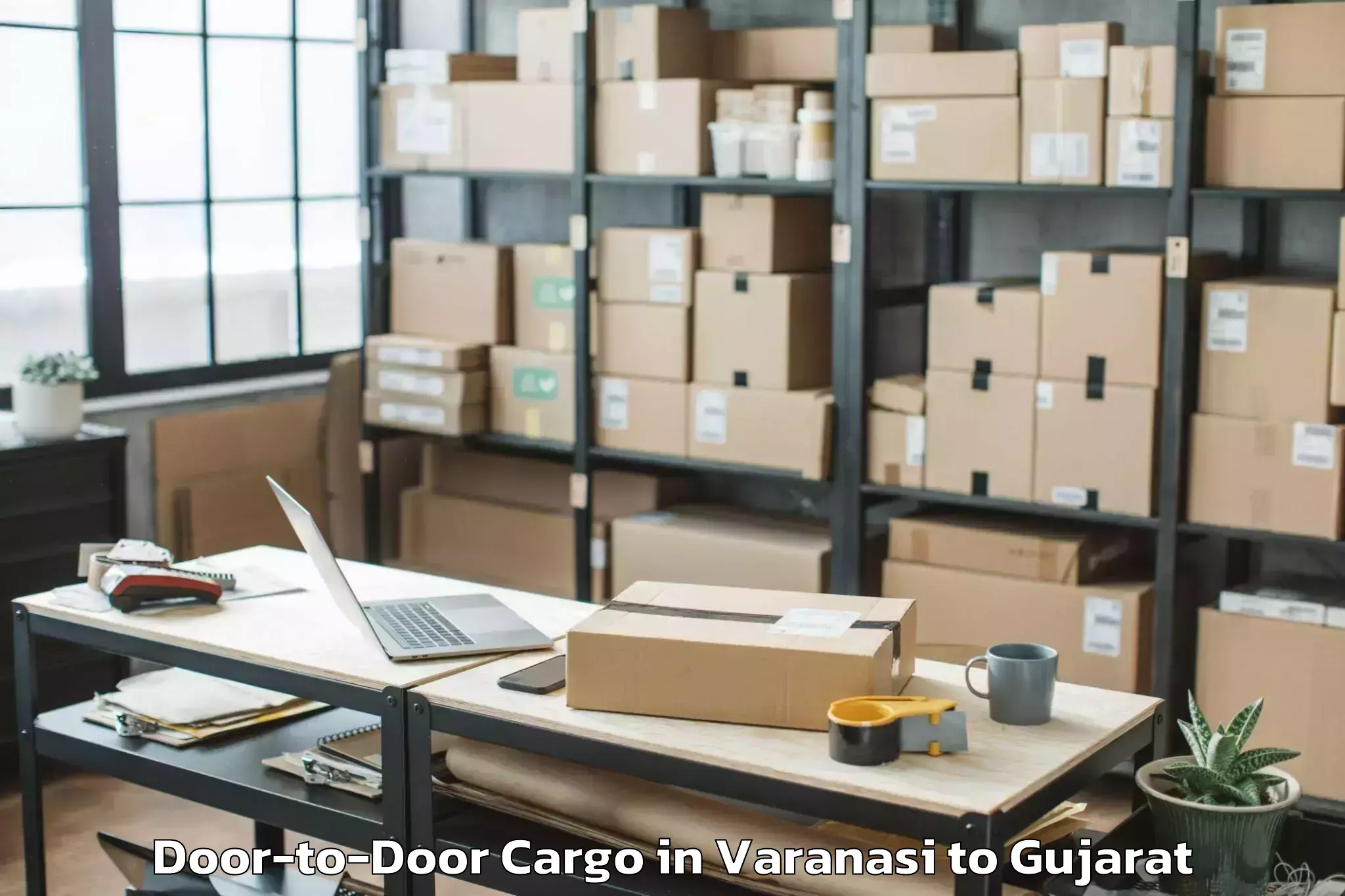 Professional Varanasi to Khedbrahma Door To Door Cargo